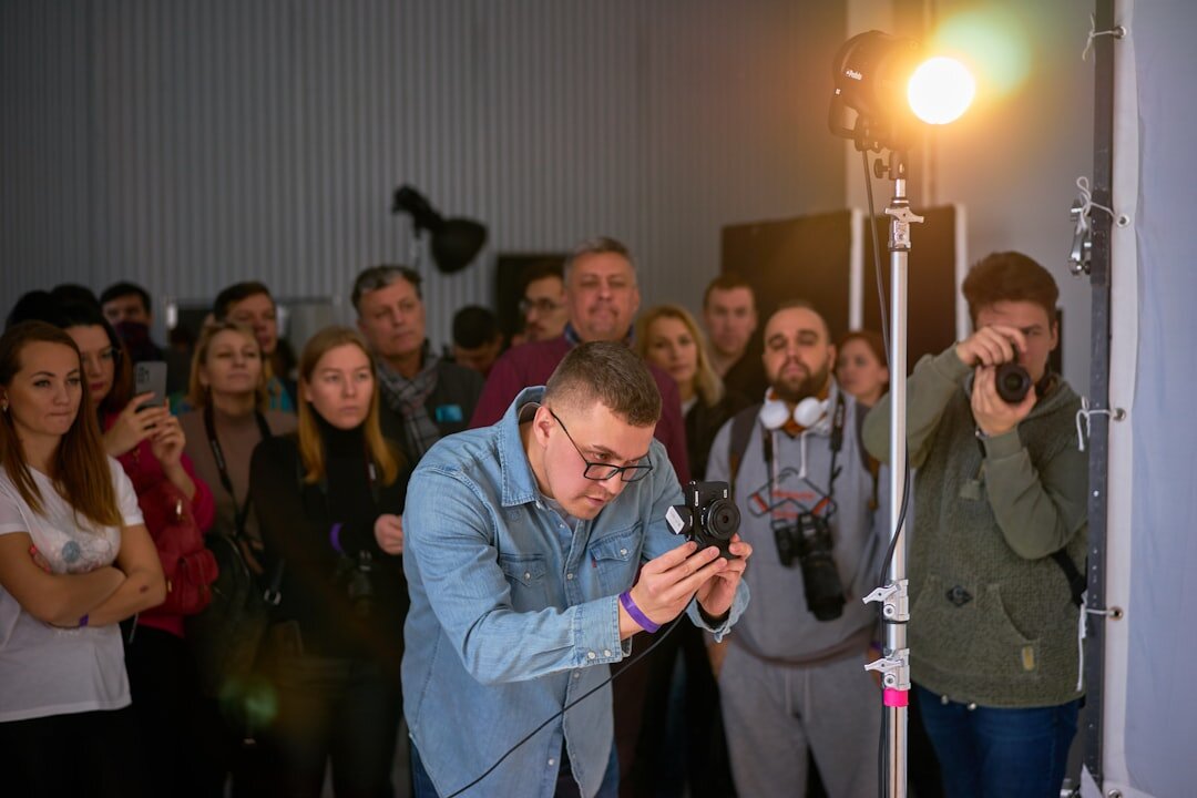Camera flashes photographing a celebrity arrival