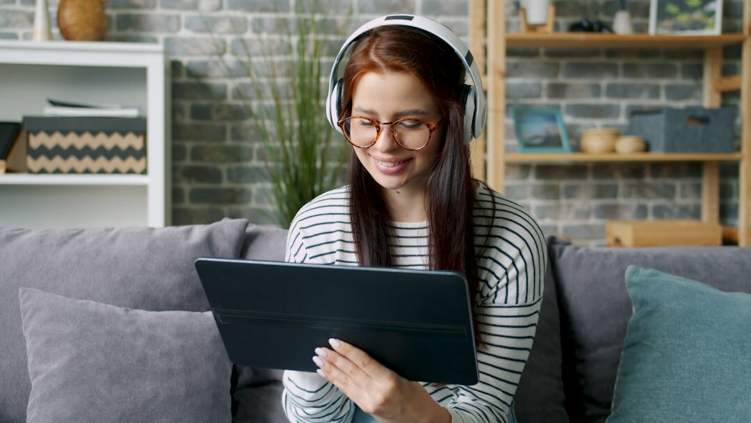 Person reading news on a tablet at home