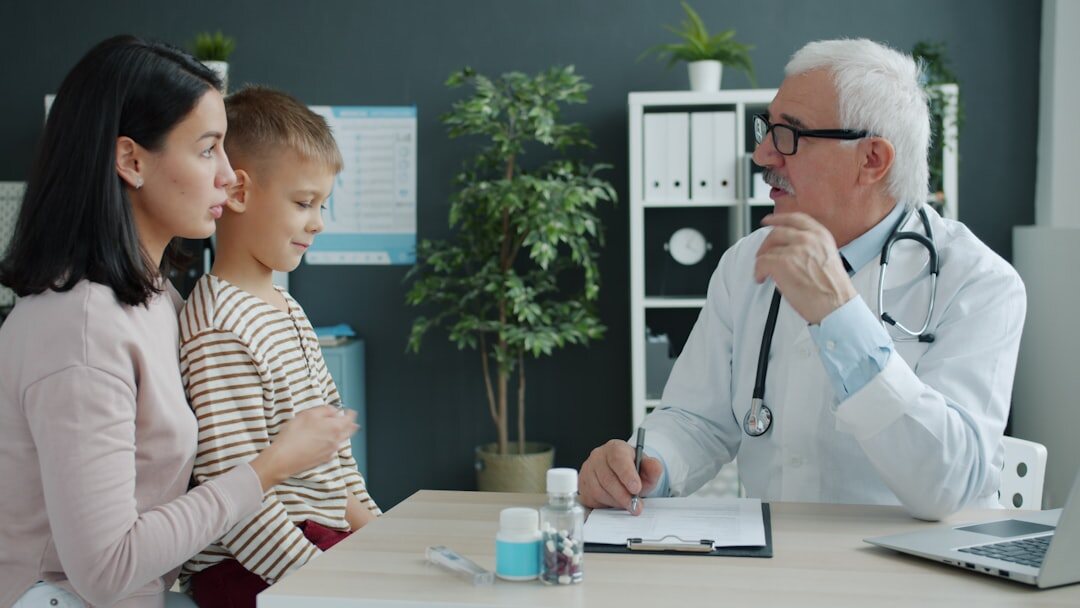 doctor examining patient in clinic