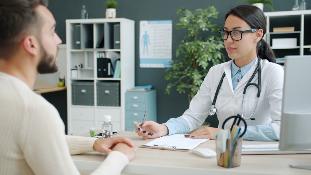 doctor examining patient in clinic
